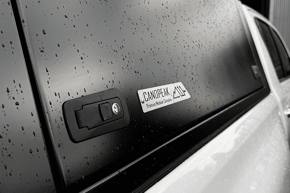 CanoPeak canopy handle and branded stainless steel badge detail