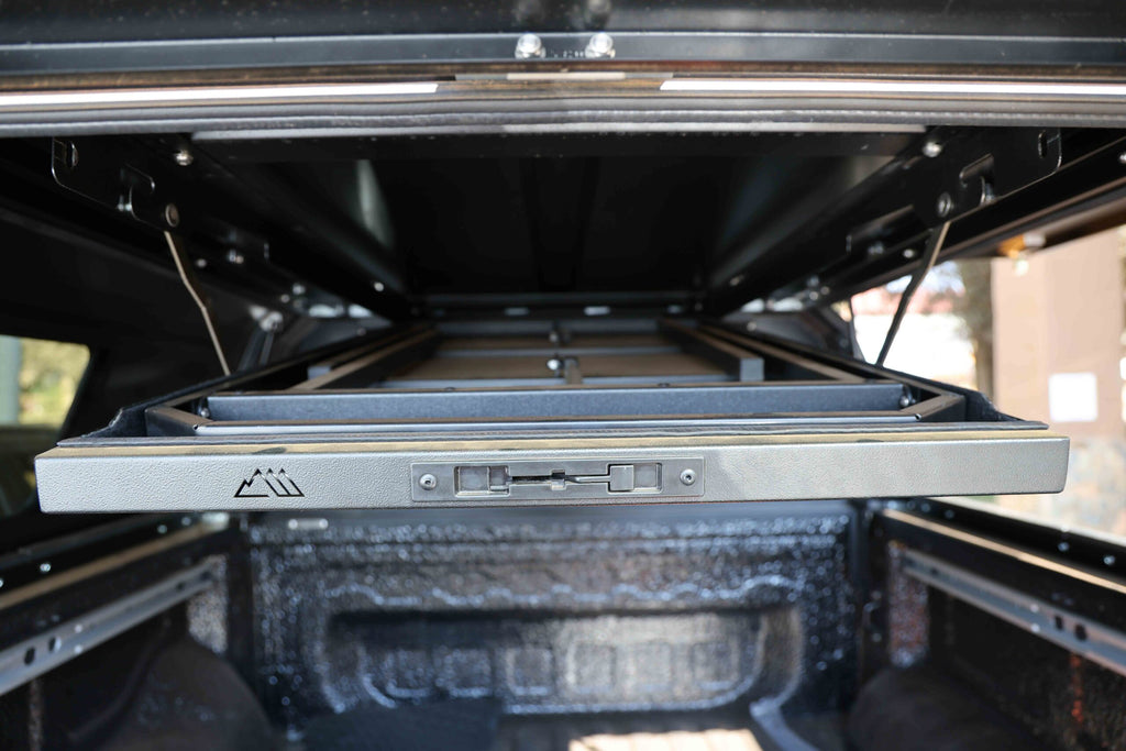 CanoPeak roof-mounted table viewed from the rear of a canopy