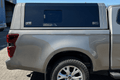 CanoPeak side window installed in an Isuzu canopy side door; illustrative set example