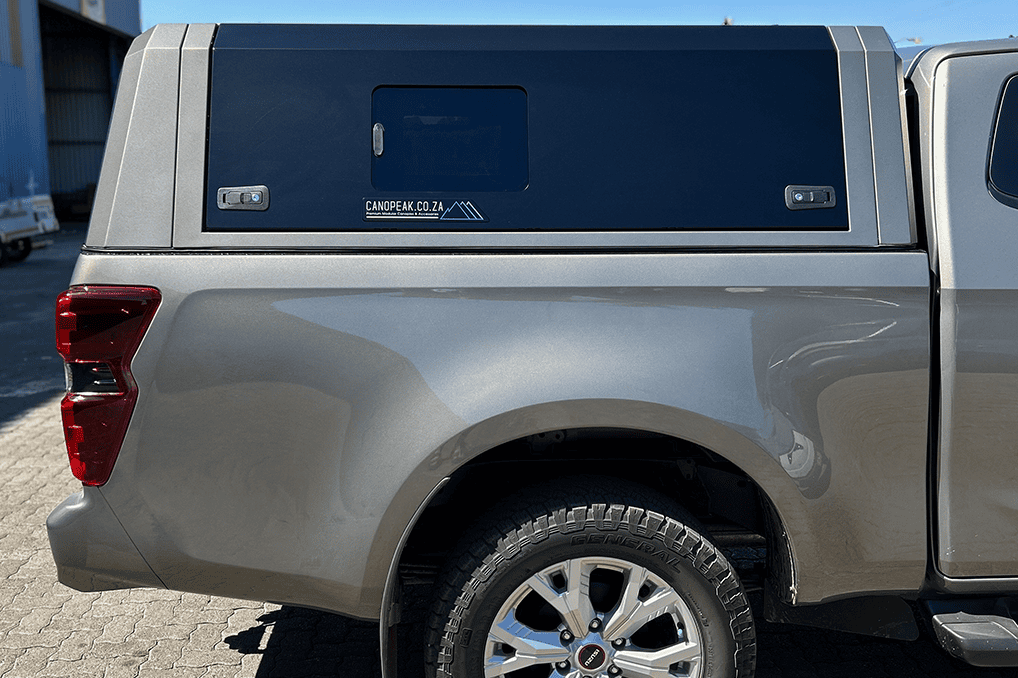 CanoPeak side window installed in an Isuzu canopy side door; illustrative set example